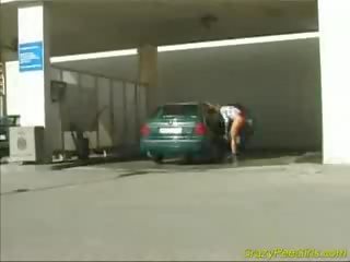 Crazy pee girl at the car wash